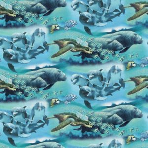 David Textiles Dolphins   Manatees on Blue Novelty Cotton Fabric